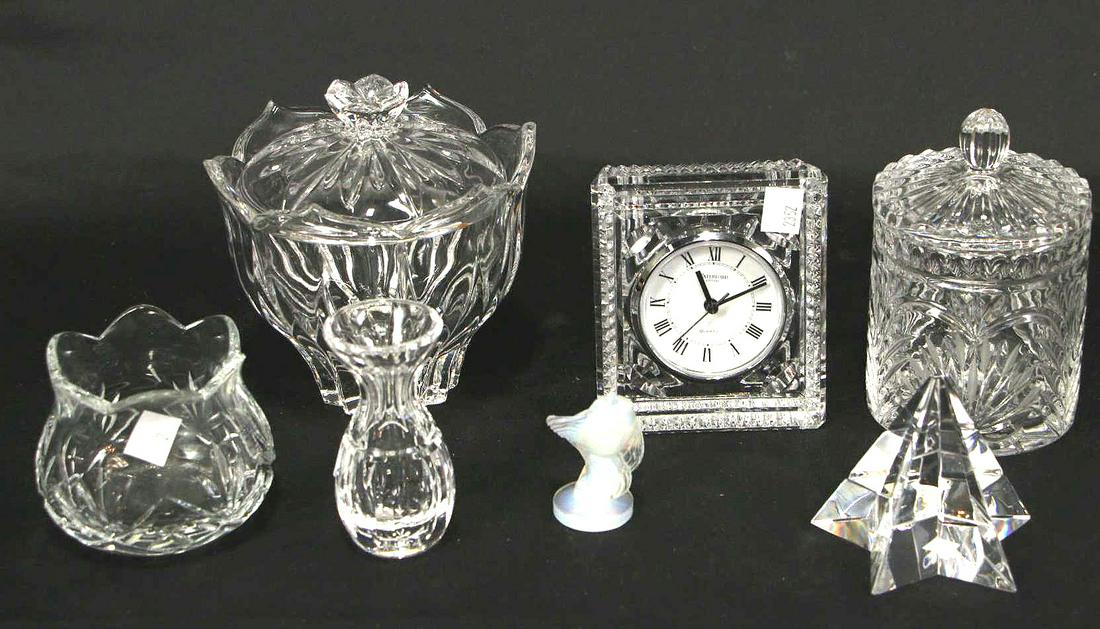 MIXED LOT OF SEVEN DECORATIVE CRYSTAL PIECES: MIXED LOT OF SEVEN DECORATIVE CRYSTAL PIECES. WATERFORD CLOCK (5"H X 4"W X 2.5"D), SABINO FISH (2.5"H X 1.75"W X 1.25"D), STAR PYRAMID (3.5"H X 3.5"W), SMALL BUD VASE (4"H X 2"W), ROUND BOWL (3.25"H X