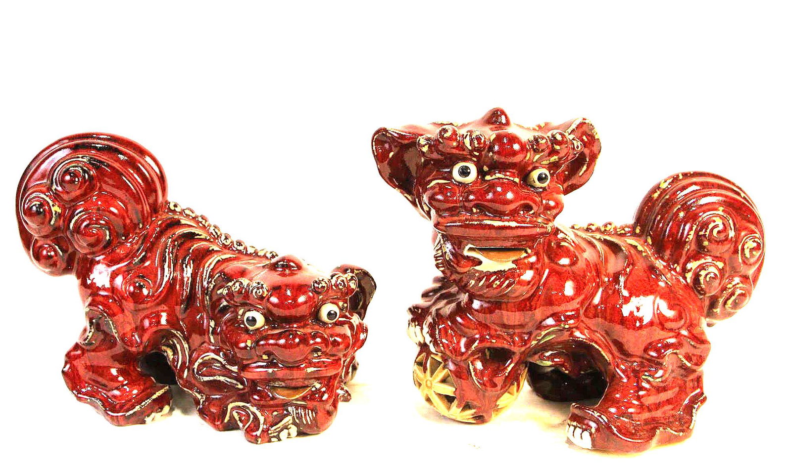 PAIR OF CHINESE SANG DE BOEUF GLAZED FOO DOGS: PAIR OF CHINESE SANG DE BOEUF GLAZED CERAMIC FOO DOGS. Height: 10 in. by Width: 6 in. by Depth: 9 in.