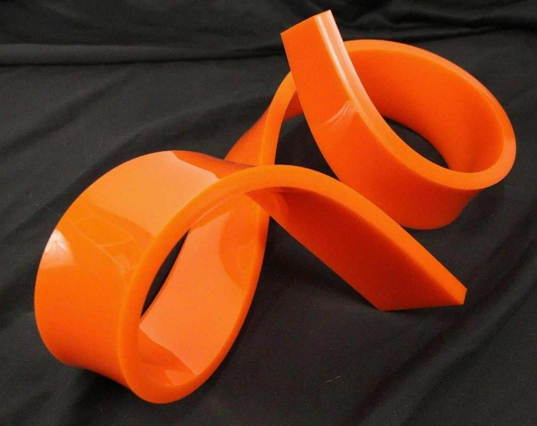 ORANGE LUCITE DECORATIVE PIECE: ORANGE LUCITE DECORATIVE PIECE Height: 8 in. by Width: 15 in. by Depth: 9