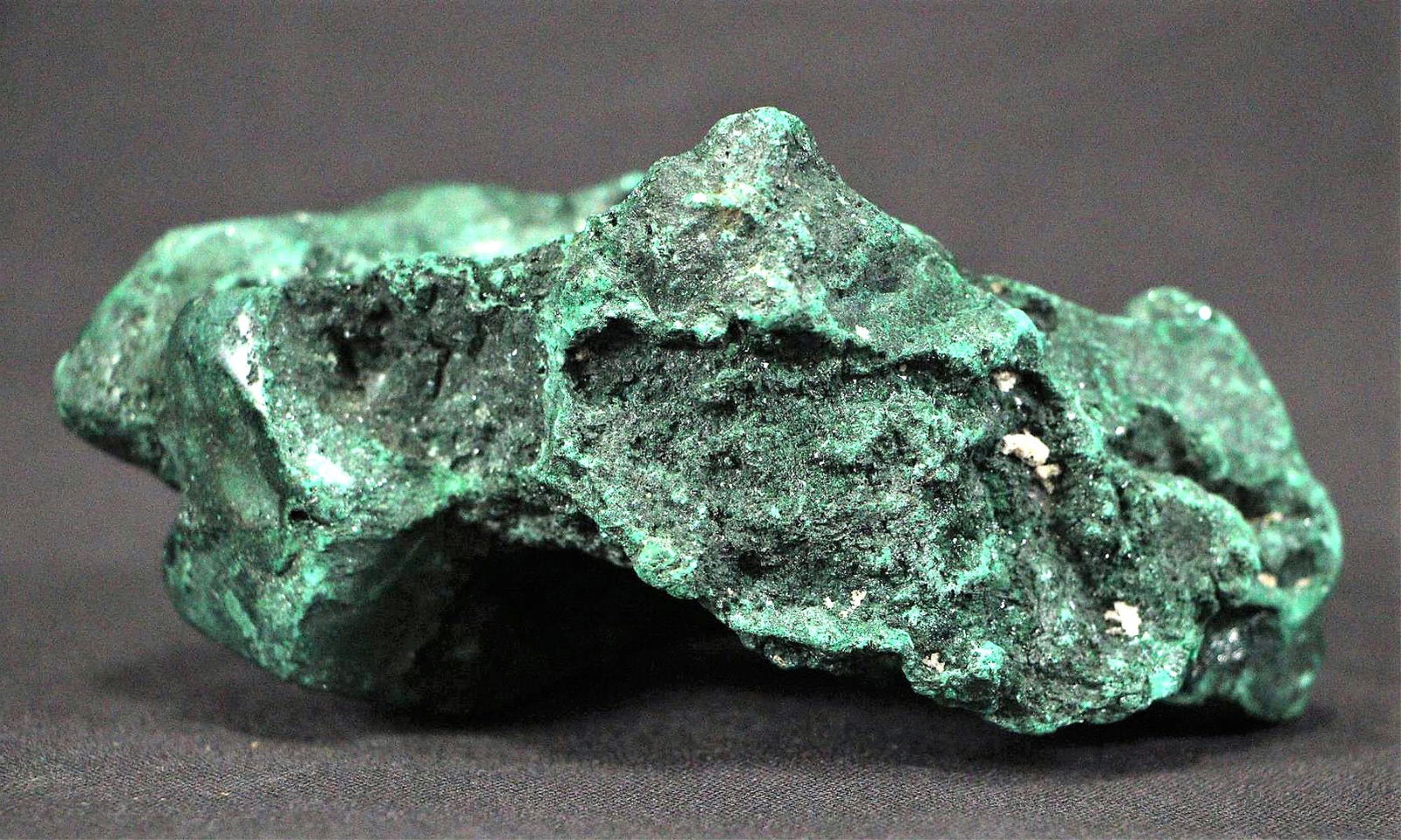 MALACHITE SPECIMEN: MALACHITE SPECIMEN - (ML61) 1.8 LB Height: 2.5 in. by Width: 5 in. by Depth: 3.5 in.