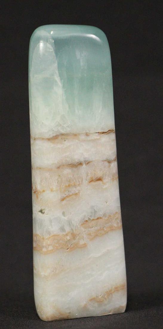 CARIBBEAN CALCITE FREEFORM: CARIBBEAN CALCITE FREEFORM - (CA18) 0.4 LB. Height: 4.5 in. by Width: 1.5 in. by Depth: .75 in.