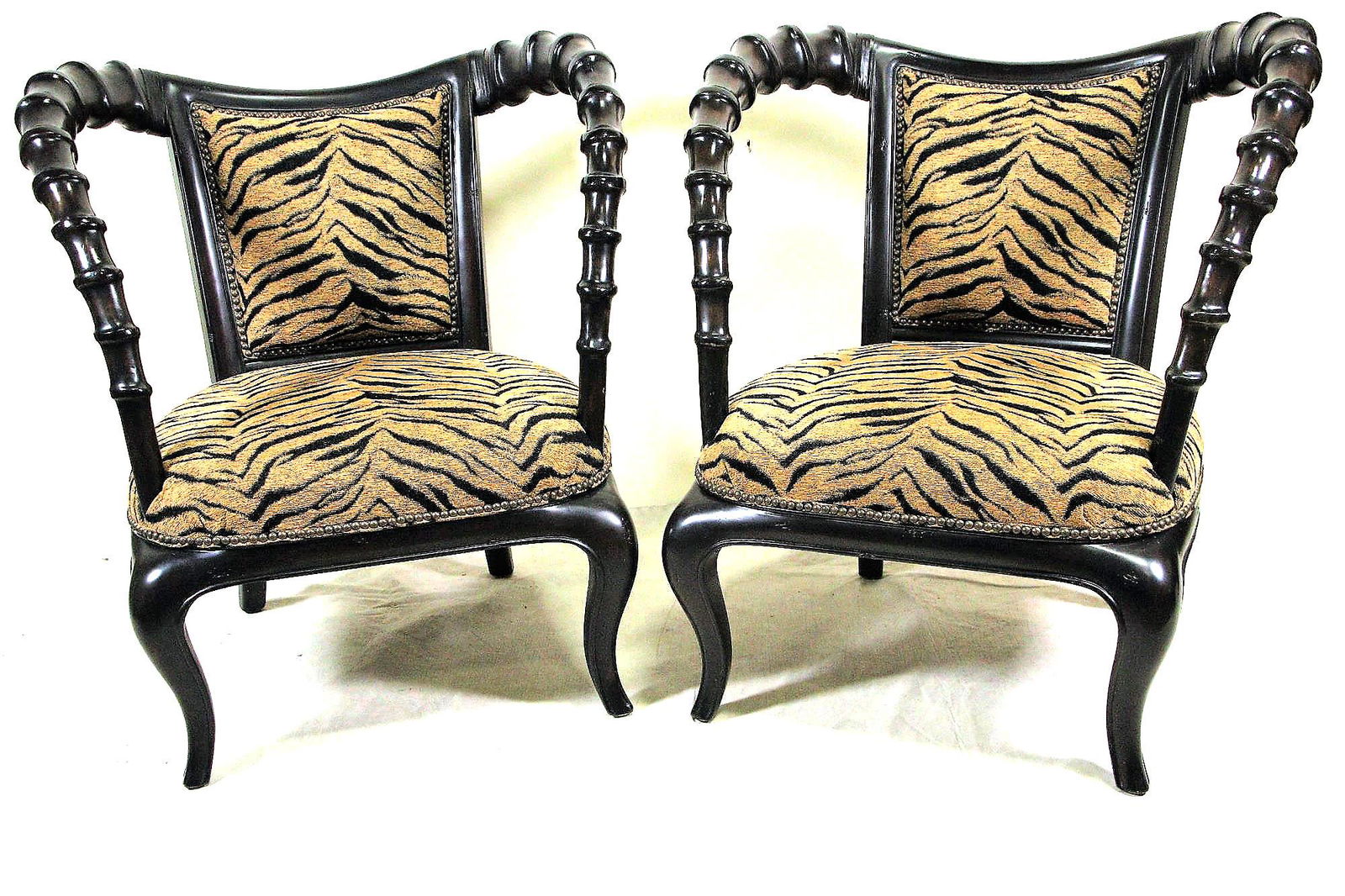 PAIR OF THOMASVILLE ERNEST HEMINGWAY ARMCHAIRS: PAIR OF THOMASVILLE ERNEST HEMINGWAY AFRICAN COLLECTION ARMCHAIRS. BROWN ZEBRA FABRIC ADLER AND SELECT HARDWOODS. Height: 36 in. by Width: 31 in. by Depth: 28 in.