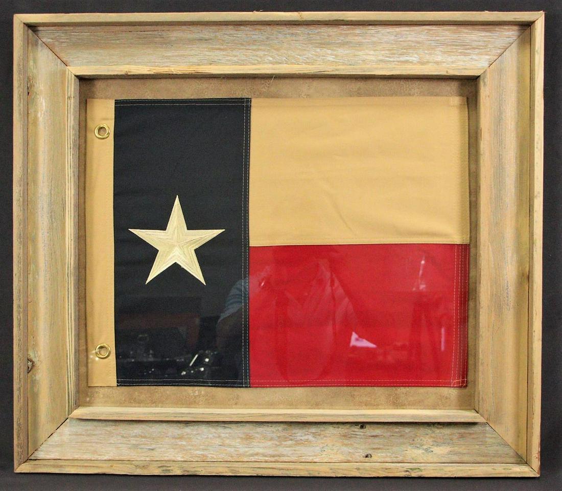FRAMED HANDSTITCHED CANVAS TEXAS FLAG: FRAMED HANDSTITCHED CANVAS TEXAS FLAG. Height: 27 in. by Width: 30 in.
