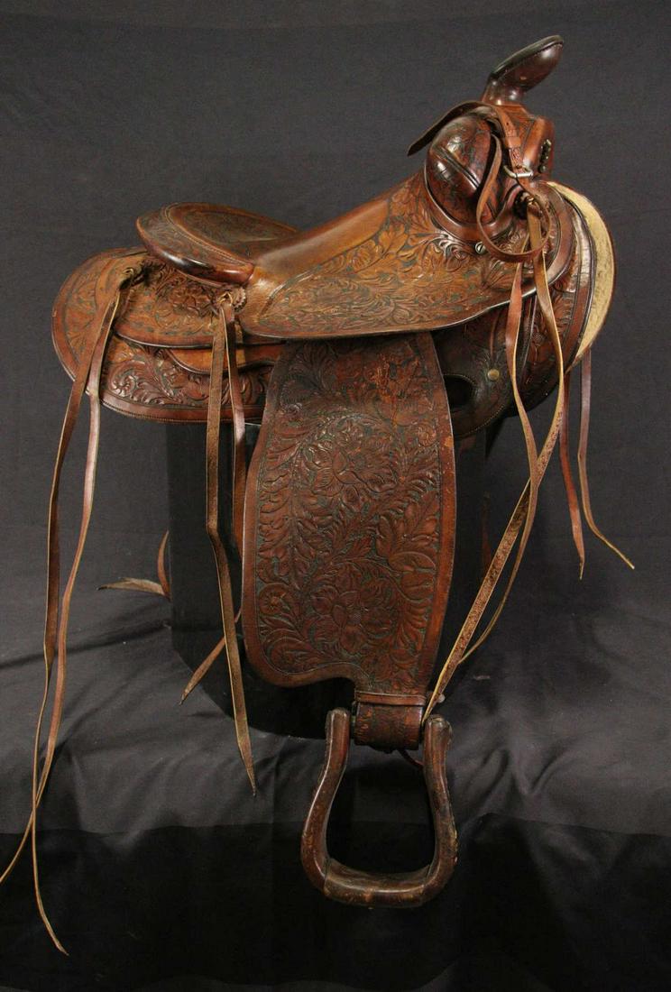 EDWARD H BOHLIN HAND TOOLED CUSTOM SADDLE: EDWARD H BOHLIN FULLY HAND TOOLED CUSTOM SADDLE. MADE IN HOLLYWOOD, CA. BOHLIN MADE THE SADDLES FOR THE STARS. Height: 38 in. by Width: 20 in. by Depth: 27 in.