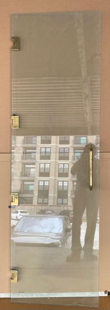 PAIR OF GLASS DOORS WITH BRASS HARDWARE: PAIR OF GLASS DOORS WITH BRASS HARDWARE. Height: 83 in. by Width: 26 in.