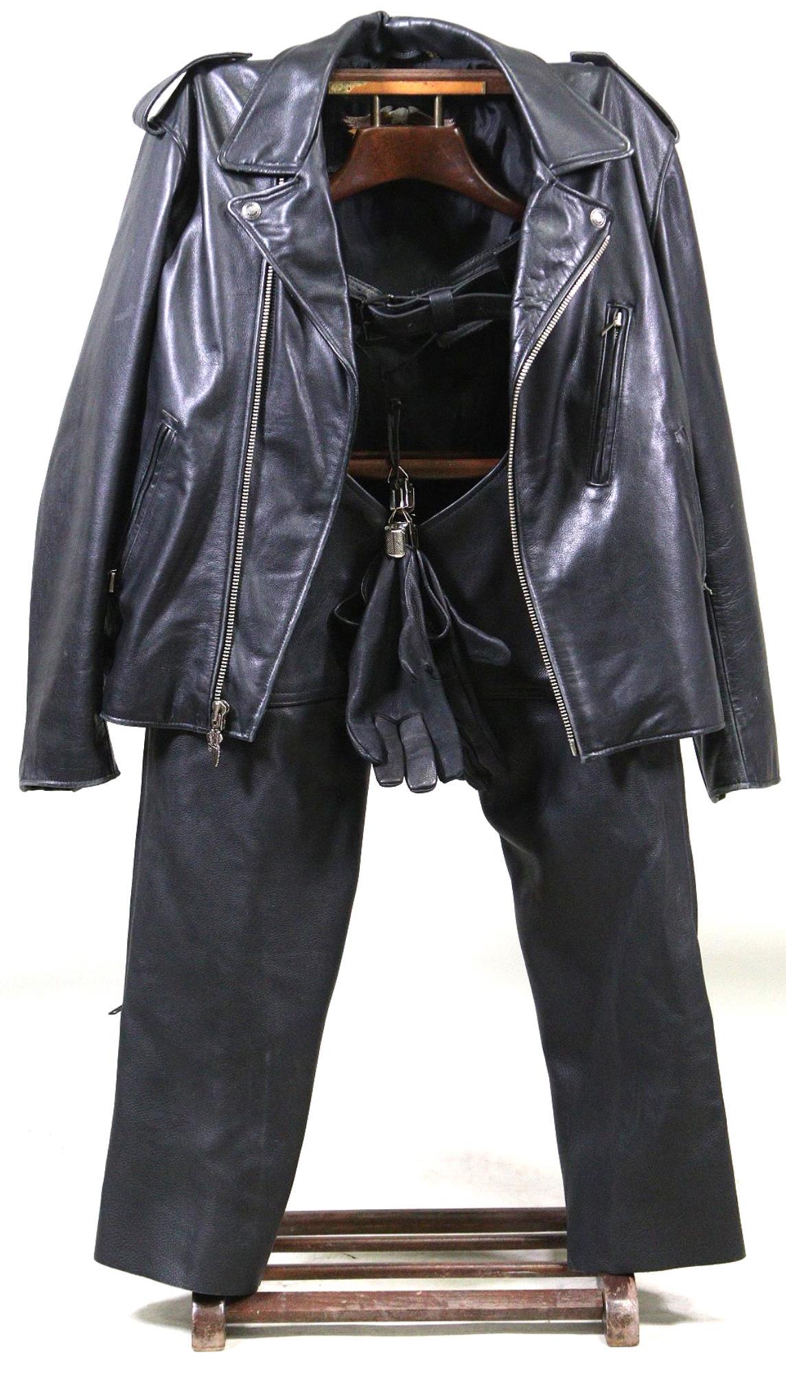 JOHN WALTON'S PERSONAL MOTORCYCLE RIDING LEATHERS: JOHN WALTON'S PERSONAL BLACK LEATHER MOTORCYCLE RIDING LEATHERS - INCLUDES VINTAGE HARLEY DAVIDSON SIZE XL JACKET, US MADE CO. SIZE XL LEATHER CHAPS, & PAIR OF DAMASCUS DEERSKIN SIZE 10 GLOVES ***ALL 