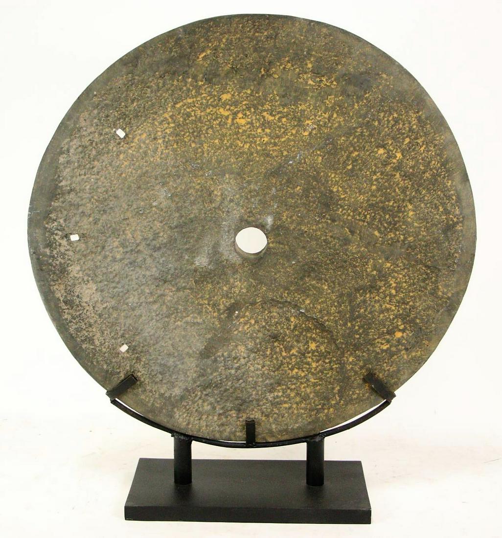 LARGE BLACK MILLSTONE ON STAND (1 of 2)