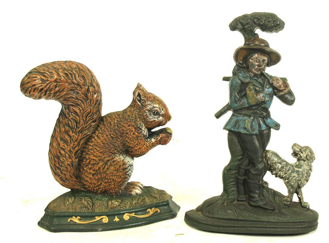 MIXED LOT OF TWO DECORATIVE IRON DOOR STOPS: MIXED LOT OF TWO DECORATIVE IRON DOOR STOPS. Height: 14 in. by Width: 9 in. by Depth: 4 in.