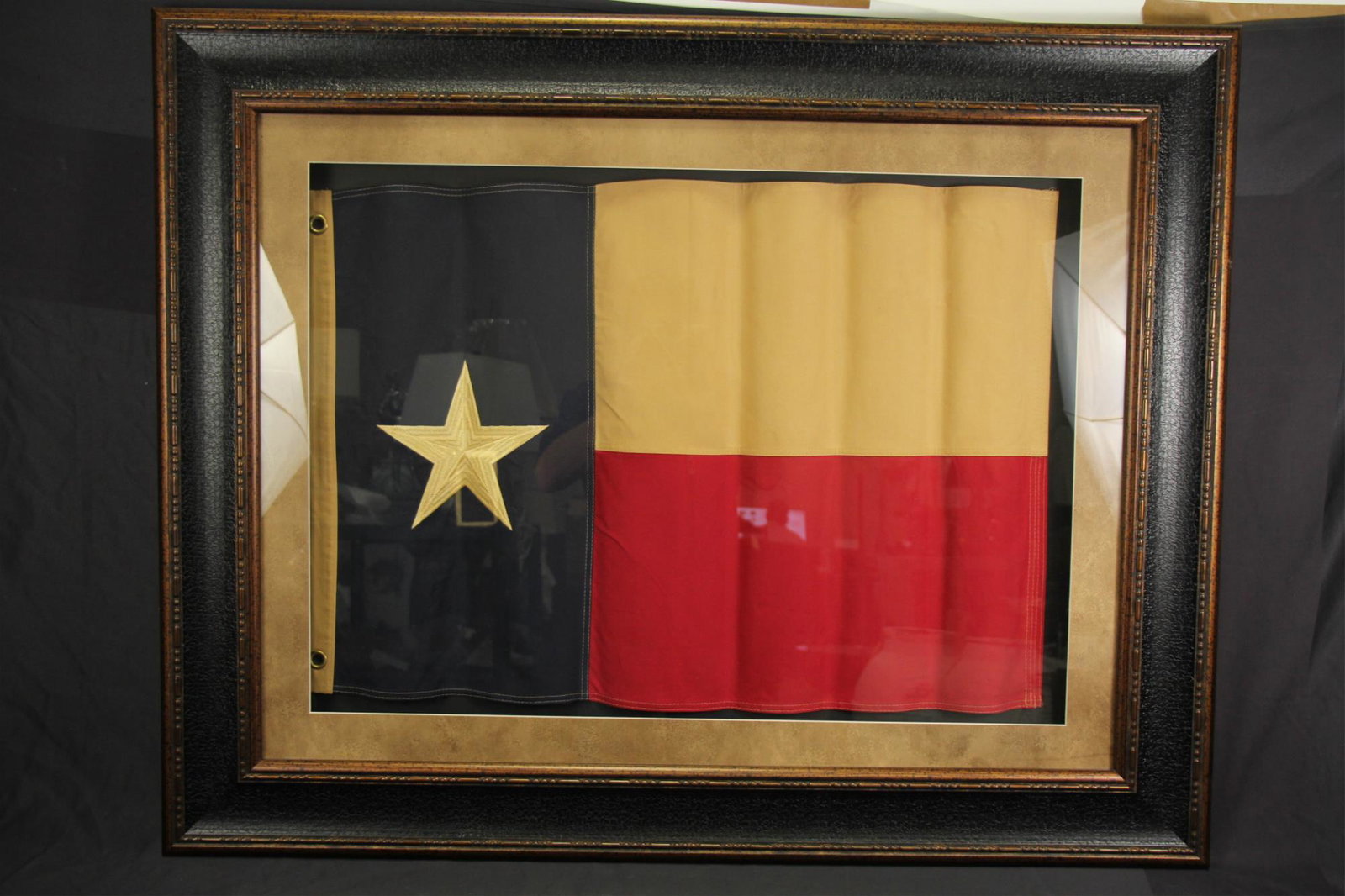 FRAMED WAVY TEXAS FLAG: FRAMED WAVY TEXAS FLAG. Height: 39 in. by Width: 49 in.