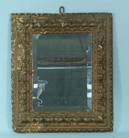 17th CENTURY ITALIAN ANTIQUE WOOD CARVED MIRROR: 17th C. ITALIAN ANTIQUE WOOD CARVED AND GILDED FRAMED BEVELED MIRROR. Height: 24 in. by Width: 20 1/2 in. by Depth: 2 1/2 in.