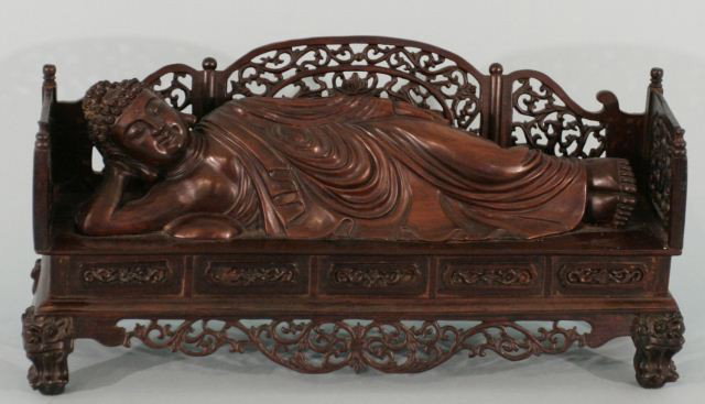 CARVED ROSEWOOD RECLINING BUDDHA: RECLINING BUDDHA (BUDDHIST DEITY GODDESS OF MERCY) CARVED FROM ROSEWOOD. 50 TO 70 YEARS OLD. Height: 9 in. by Width: 18 1/2 in. by Depth: 5 1/2 in.