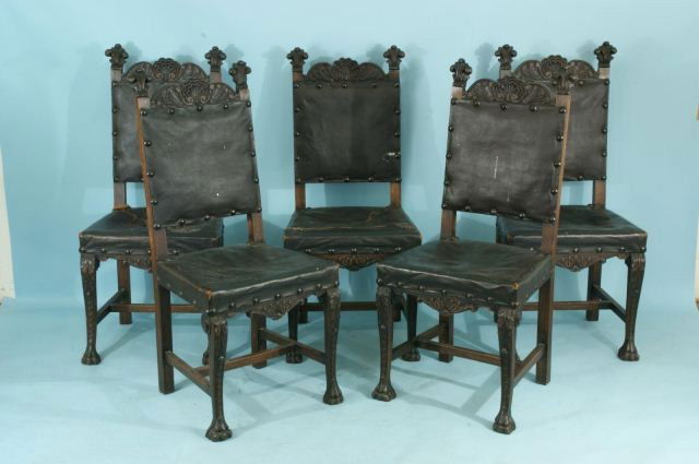 SET OF FIVE ANTIQUE OAK ROCOCO SIDE CHAIRS: SET OF FIVE ANTIQUE OAK ROCOCO SIDE CHAIRS WITH LEATHER SEAT AND BACKS. CIRCA 1900. Five have damage in seat. Height: 43 in. by Width: 19 in. by Depth: 19 in.