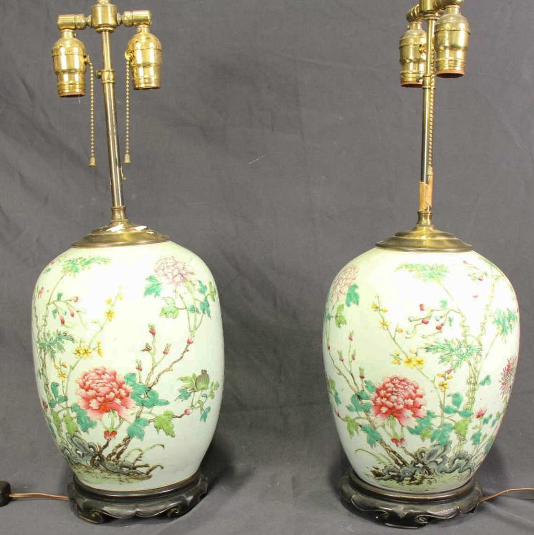 PAIR OF ANTIQUE FAMILLE ROSE PORCELAIN JAR LAMPS: PAIR OF ANTIQUE FAMILLE ROSE PORCELAIN JAR LAMPS.