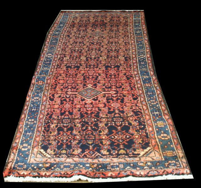 HAMADAN IRANIAN RUNNER: HAMADAN IRANIAN RUNNER IN BLUE, NAVY IN RED BACKROUND. WOOL ON COTTON FOUNDATION. Height: 10 ft. 9 in. by Width: 3 ft. 9 in.