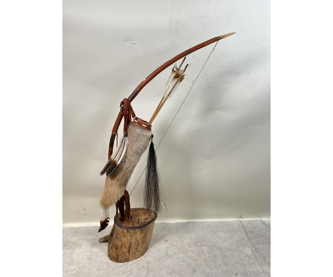 BOW AND ARROW WITH SHEATH SCULPTURE: BOW AND ARROW WITH SHEATH SCULPTURE Height: 59 in. by Width: 28 in. by Depth: 10 in.