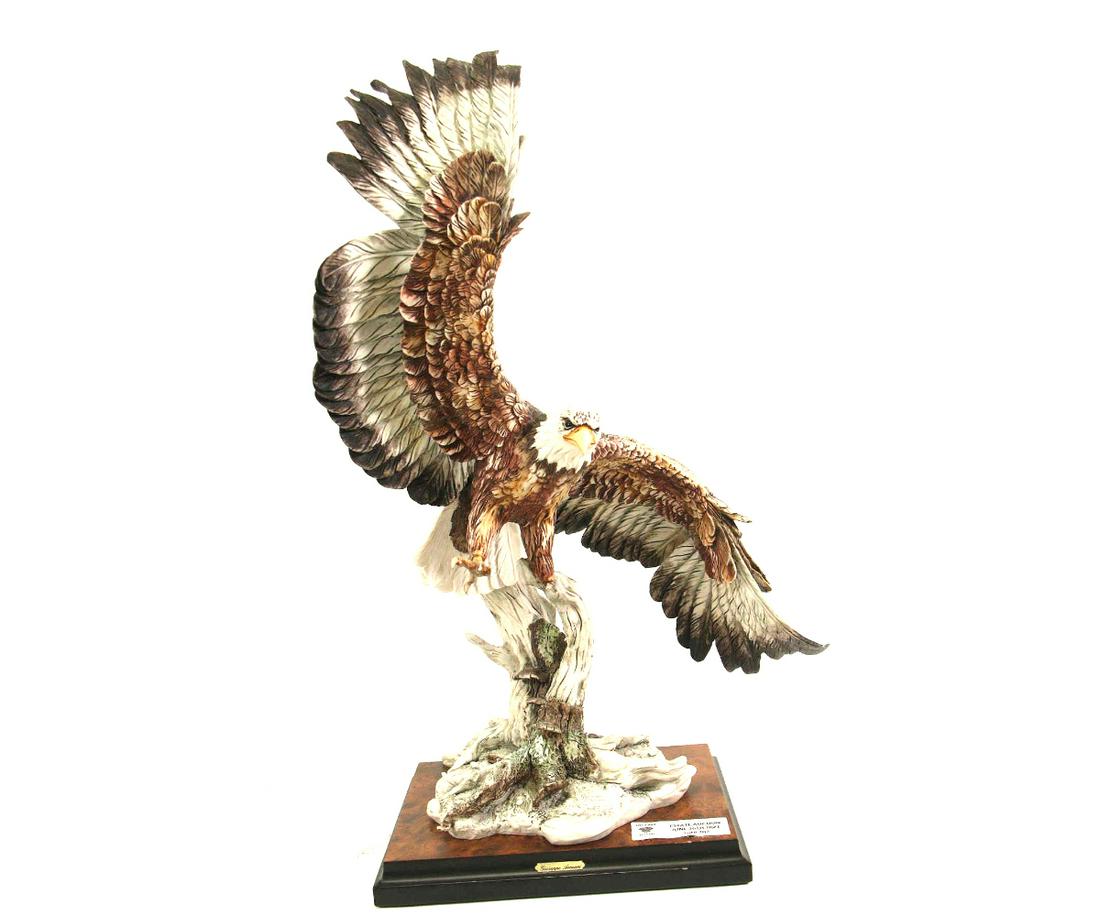 GIUSEPPE ARMANI PORCELAIN EAGLE SCULPTURE: GIUSEPPE ARMANI PORCELAIN EAGLE SCULPTURE. Height: 23 in. by Width: 20 in. by Depth: 7.5 in.