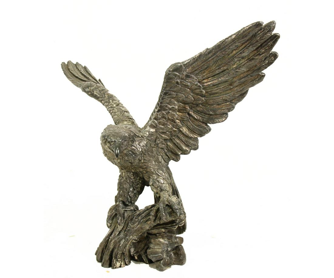 SILVER GILT OVER PORCELAIN EAGLE STATUE: SILVER GILT OVER PORCELAIN EAGLE STATUE (ONE WING HAS REPAIRED DAMAGE). Height: 17 in. by Width: 22 in. by Depth: 8 in. Height: 17 in. by Width: 22 in. by Depth: 8 in.