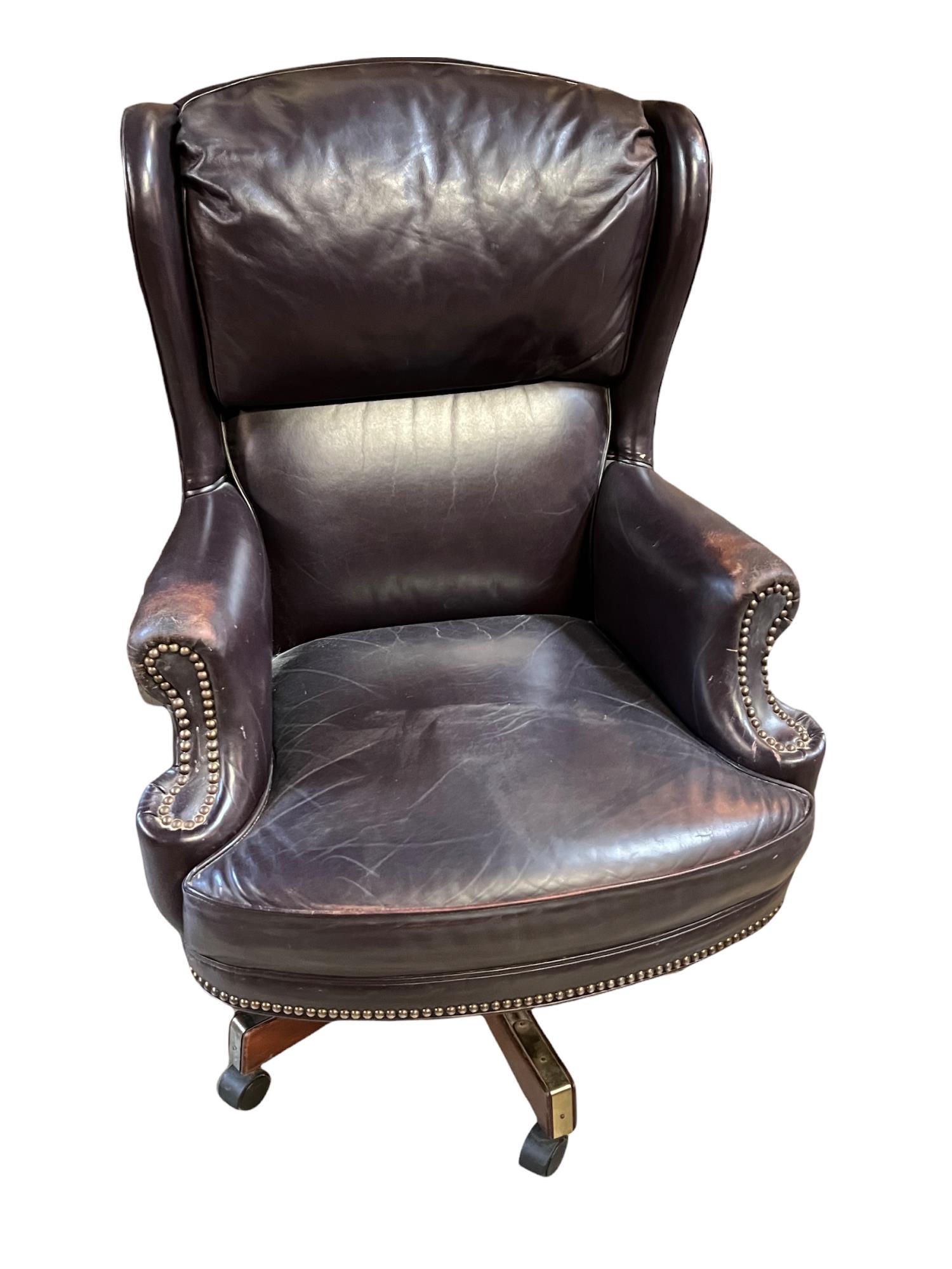 PURPLE LEATHER EXECUTIVE DESK CHAIR: PURPLE LEATHER EXECUTIVE DESK CHAIR Height: 45 in. by Width: 30 in. by Depth: 24 in.