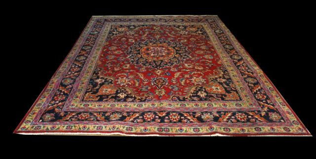MAHAL IRANIAN RUG: MAHAL IRANIAN RUG IN NAVY IN A RED BACKROUND. Height: 10 ft. 8 in. by Width: 8 ft. 3 in.