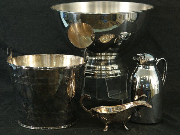 LOT OF FOUR ASSORTED SILVER ITEMS: LOT OF FOUR ASSORTED SILVER ITEMS. SILVERPLATED SAUCE (11 BY 4 1/2 IN.)_BOAT, ICEWATER (12 BY 12 IN. ) BUCKET, LARGE (17 BY 11 IN.) PUNCH BOWL, 1 PLASTIC SILVERTONE PITCHER.