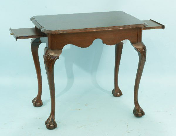 CHIPPENDALE STYLE MAHOGANY TEA TABLE WITH BALL ANS: CHIPPENDALE STYLE MAHOGANY TEA TABLE WITH BALL AND CLAW FEET AND DUAL CANDLE SLIDES. Height: 26 1/2 in. by Width: 28 in. by Depth: 18 1/2 in.