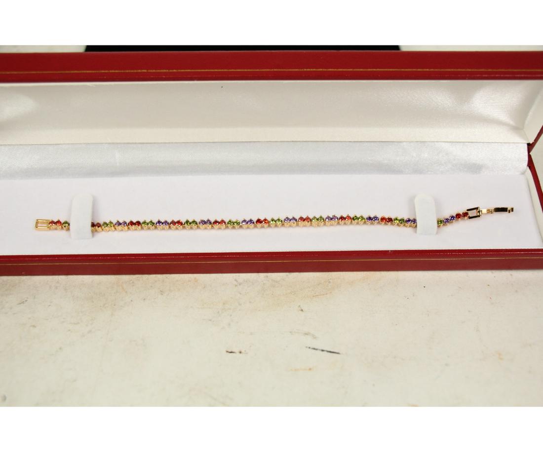 PERIDOT, AMETHYST & GARNET TENNIS BRACELET: PERIDOT, AMETHYST & GARNET TENNIS BRACELET - (L219)