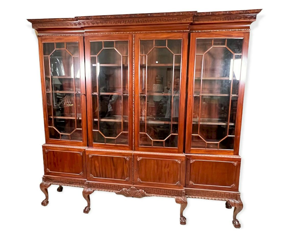 CHIPPENDALE MAHOGANY BREAKFRONT: CHIPPENDALE MAHOGANY BREAKFRONT ON BALL AND CLAW FEET. FOUR DOORS OVER FOUR DOORS. Height: 87 in. by Width: 14 in. by Depth: 90 in.