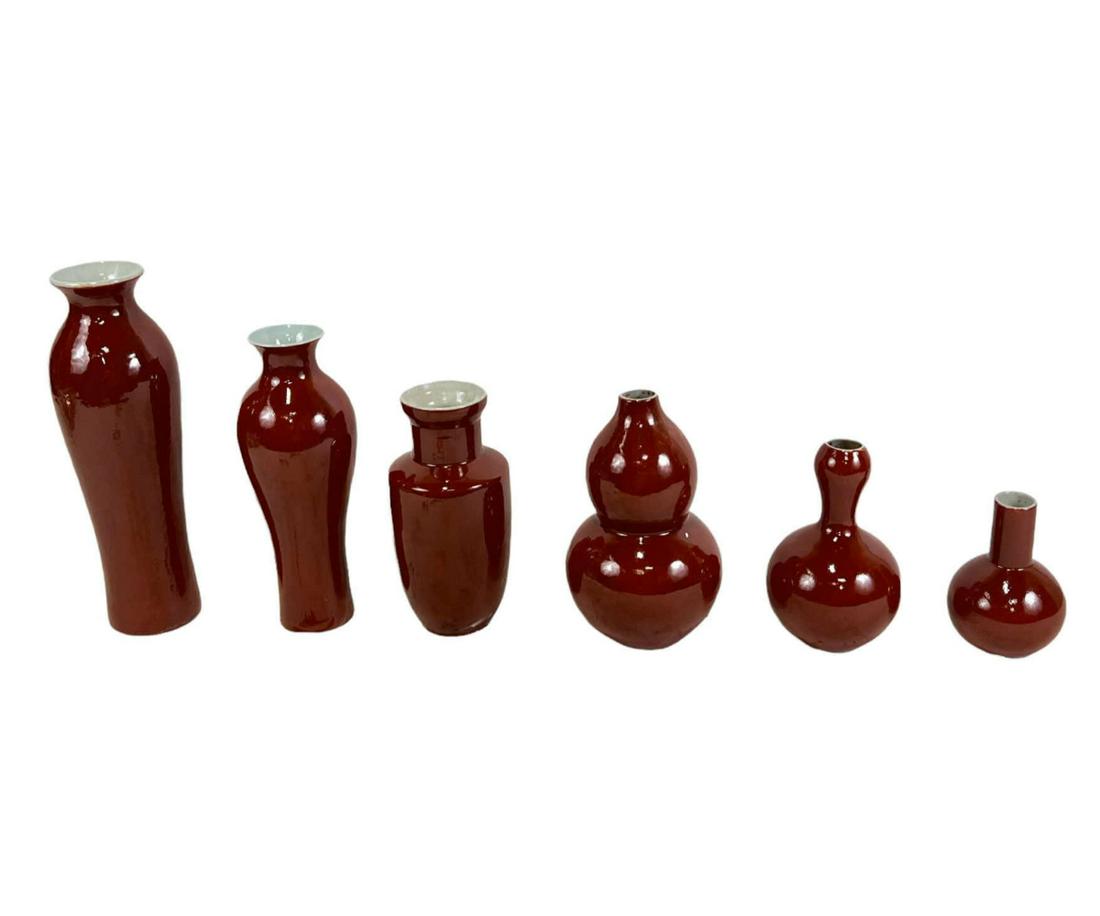 SET OF SIX SANG DE BOEUF GRADUATED SIZE VASES: SET OF SIX SANG DE BOEUF GRADUATED SIZE VASES. LARGEST 12", SMALLEST 3.5".