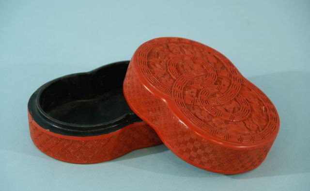 CHINESE CARVED CINNABAR BOX: CHINESE CARVED CINNABAR BOX. Height: 2 in. by Width: 4 3/4 in. by Depth: 3 1/2 in
