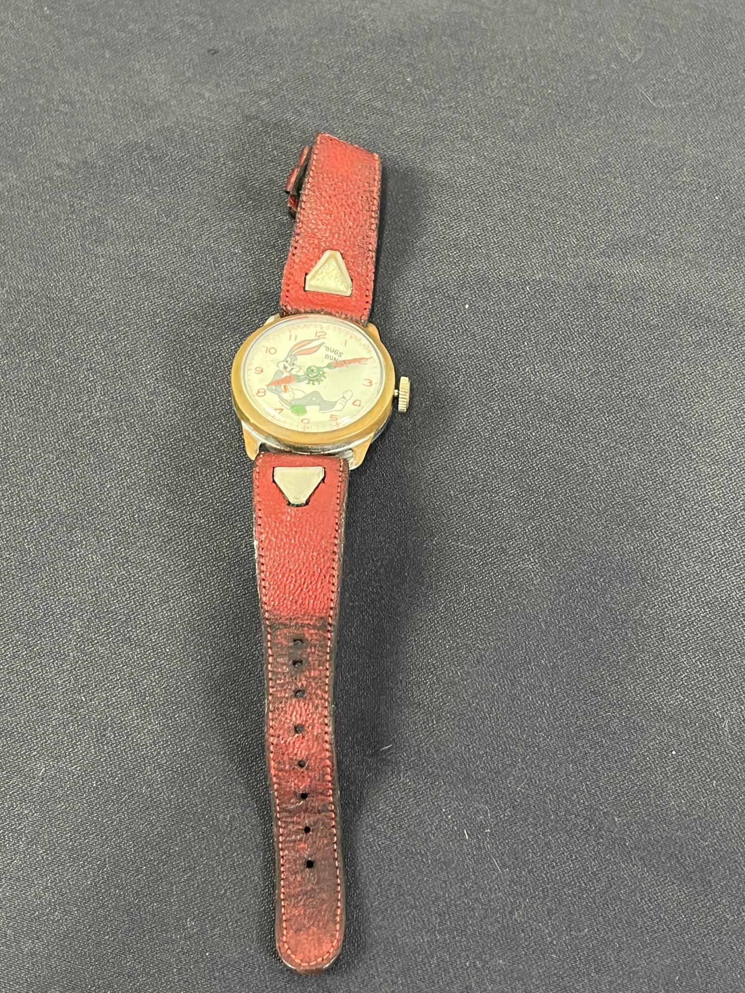 VINTAGE 1951 BUGS BUNNY MANUAL WATCH: An authentic "Bugs Bunny" manual watch of 1951 vintage. This watch has the original band & runs.