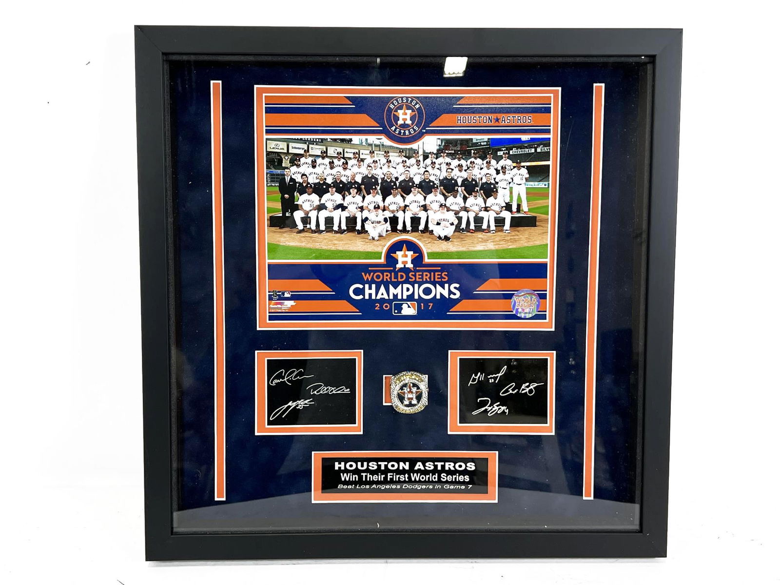 2017 HOUSTON ASTROS WORLD SERIES CHAMPIONS RING: FRAMED 2017 HOUSTON ASTROS WORLD SERIES CHAMPIONSHIP TEAM PHOTO & RING. Height: 17 in. by Width: 17 in.