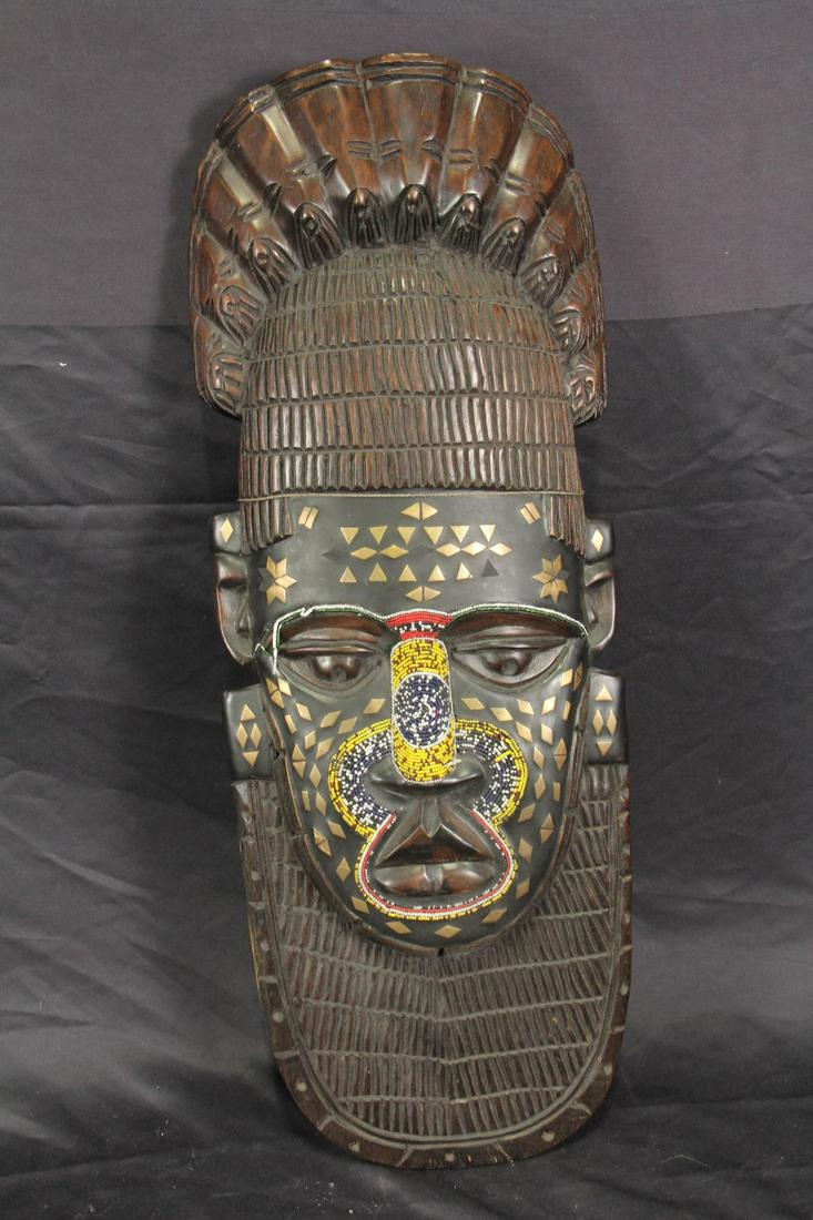 WEST AFRICAN CARVED AND PAINTED WOOD MASK: WEST AFRICAN CARVED AND PAINTED WOOD MASK Height: 29 in. by Width: 11 in. by Depth: 3 in.