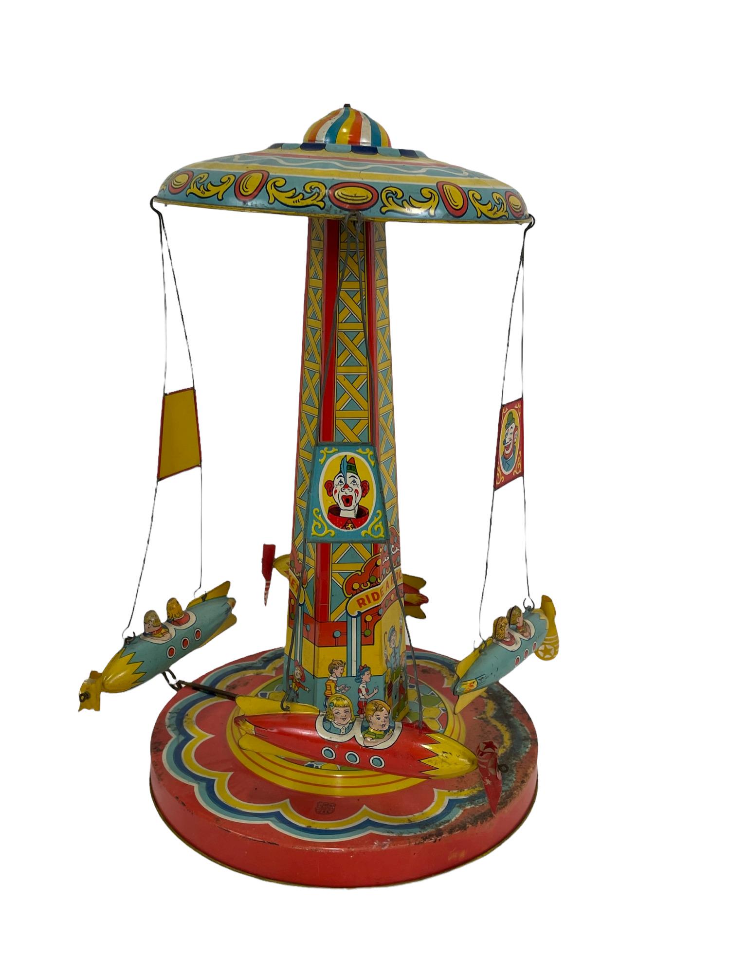 VINTAGE J. CHEIN CO. PAINTED TIN RIDE-A-ROCKET: VINTAGE J. CHEIN CO. U.S.A. PAINTED TIN RIDE-A-ROCKET. Height: 18 in. by Width: 11 in. by Depth: 11 in.