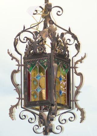 FRENCH RENAISSANCE LANTERN CHANDELIER, CIRCA 1920: 20th CENTURY FRENCH RENAISSANCE STYLE WROUGHT IRON LANTERN CHANDELIER WITH POLYCHROME PANELS ON FOUR SIDES; HAND WORKED APPLIED IRON DETAILS; SINGLE LIGHT INSIDE. CIRCA 1920 Height: 34 in. by Width: 1