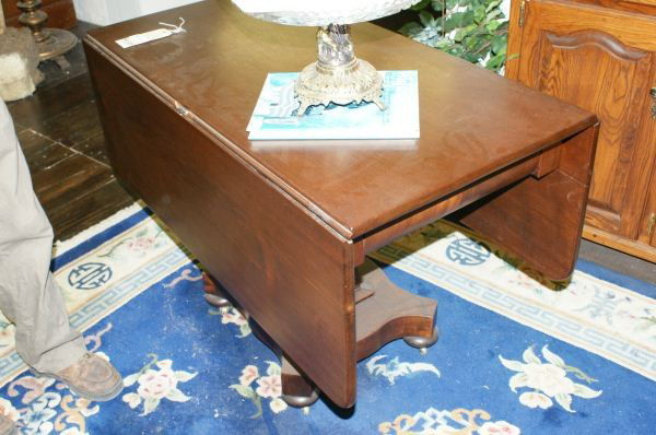 Empire drop leaf table, circa1850: Empire drop leaf table, circa1850. Buyer's Responsibility: All items must be paid the day of purchase and removed from the premises no later than 5 p.m. Monday, June 27. Or items may be picked up Satu