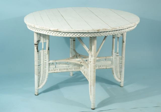 PAINTED WOODED GARDEN TABLE: PAINTED WOODED GARDEN TABLE WITH RATTAN APRON AND LEGS. Height: 30 in. by Width: 42 1/2 in. by Depth: 42 1/2 in.