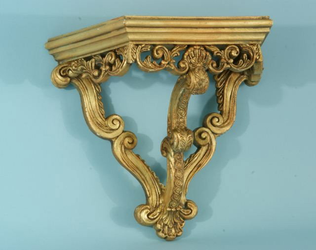 WOOD CARVED AND GILDED WALL BRACKET: WOOD CARVED AND GILDED WALL BRACKET. Height: 16 in. by Width: 16 in. by Depth: 8 in.