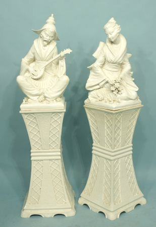 PAIR CHINESE STYLE PORCELAIN MUSICIAN SCULPTURES: PAIR OF CHINESE STYLE PORCELAIN MUSICIAN SCULPTURES ON MATCHING PEDESTALS. Both pieces have minor nicks, as is. Height: 56 1/2 in. by Width: 15 1/2 in. by Depth: 15 1/2 in.