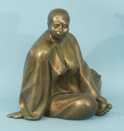 AFTER ARMANDO AMAYA "GOLD WOMAN" SCULPTURE: AFTER ARMANDO AMAYA "GOLD WOMAN" BRONZE WITH GOLD PATINA SCULPTURE. Height: 17 in. by Width: 18 in. by Depth: 16 in.