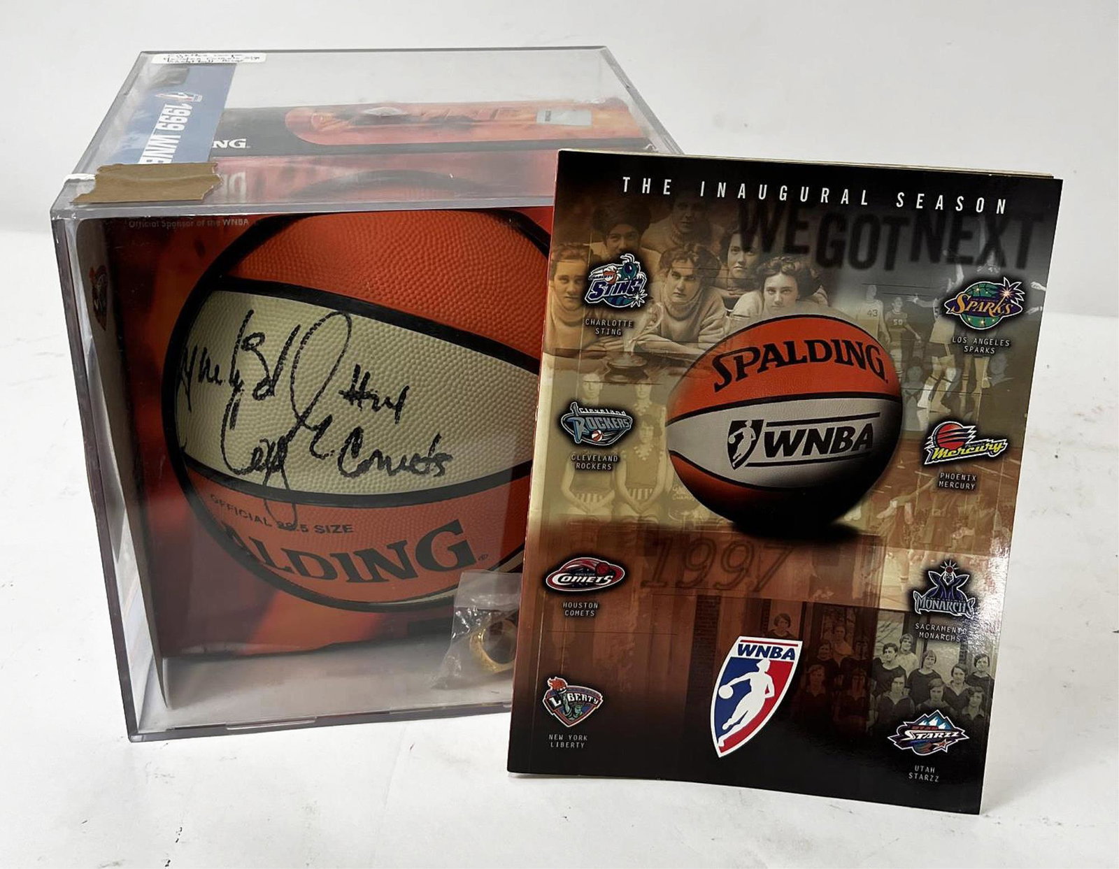 CYNTHIA COOPER HOUSTON COMETS SIGNED BASKETBALL: CYNTHIA COOPER HOUSTON COMETS SIGNED BASKETBALL AND RINGS. Height: 10 in. by Width: 10 in. by Depth: 10 in.