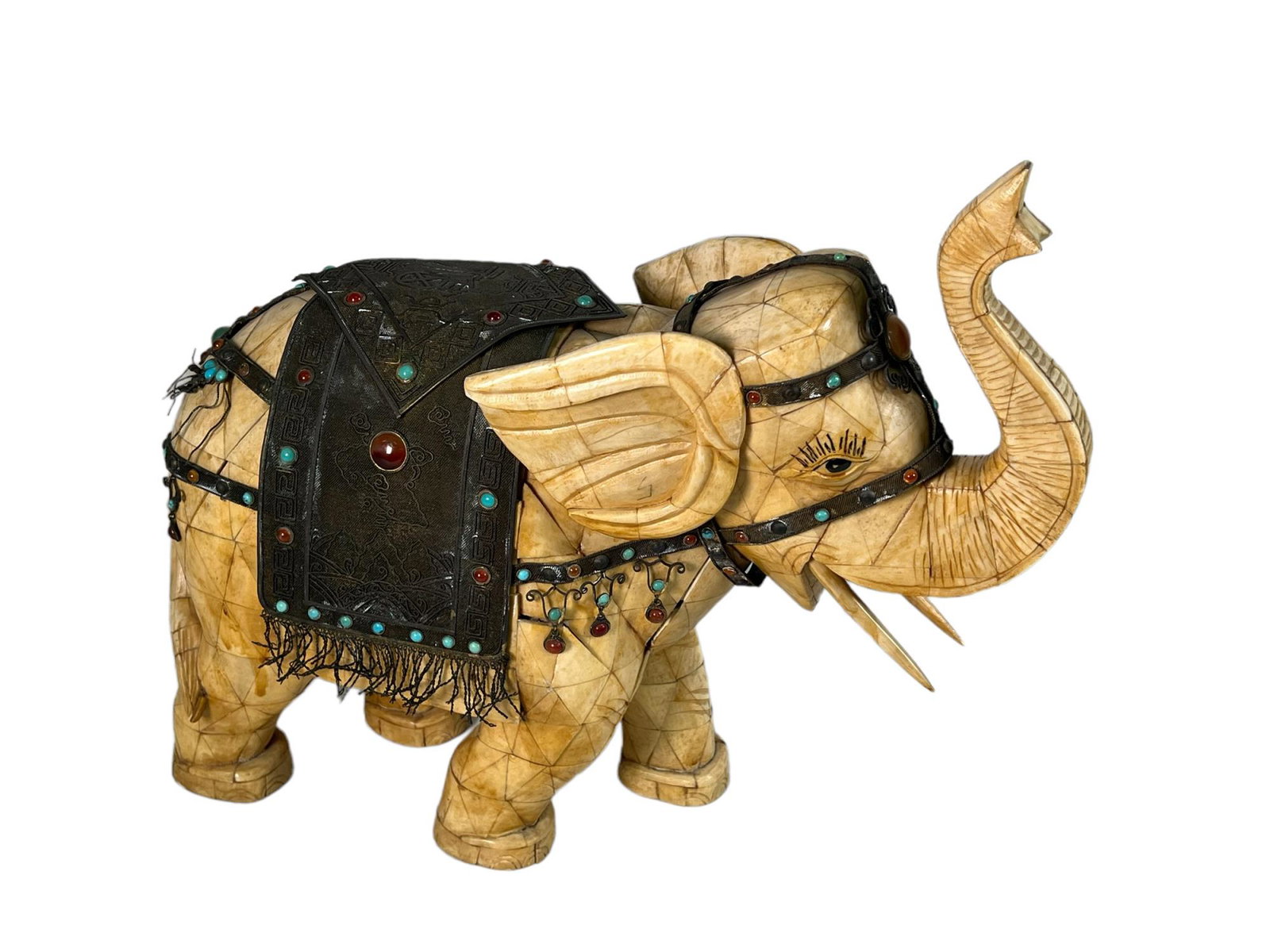 CARVED BONE TILE WITH STERLING ELEPHANT: CARVED BONE TILE WITH STERLING MOUNTED SADDLE ELEPHANT. Height: 15 in. by Width: 6 in. by Depth: 16 in.