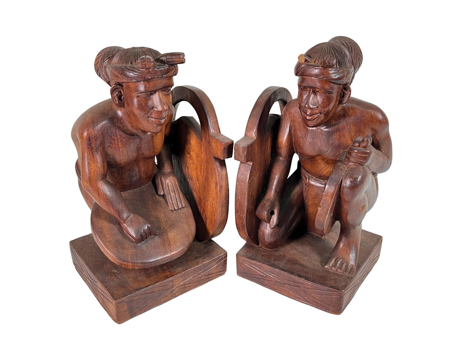 PAIR WOOD CARVED INDONESIAN BOOKENDS: PAIR WOOD CARVED INDONESIAN BOOKENDS. Height: 12 in. by Width: 7 in. by Depth: 6 in.