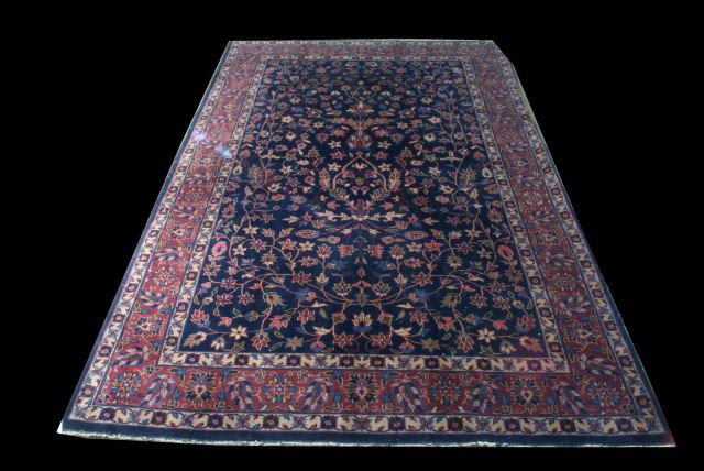 ANTIQUE MASHAD RUG IN NAVY AND ROSE: ANTIQUE MASHAD RUG IN NAVY AND ROSE. HEAVY WEAR THROUGHTOUT AND FRAYED EDGES. Height: 10 ft. 8 1/2 in. by Width: 7 ft. 0 in.