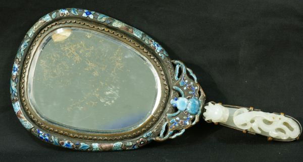 ANTIQUE CHINESE HAND MIRROR WITH SILVER & JADE: ANTIQUE CHINESE HAND MIRROR IN SILVER ENAMEL & CARVED JADE HANDLE Height: 10 1/2 in. by Width: 5 in. by Depth: 1 1/4 in.