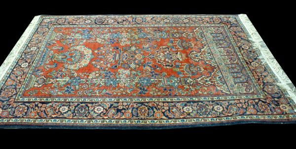 HAND KNOTTED PERSIAN RUG IN RUST AND NAVY: HAND KNOTTED PERSIAN RUG IN RUST AND NAVY. Height: 7 ft. 0 in. by Width: 4 ft. 3 in.