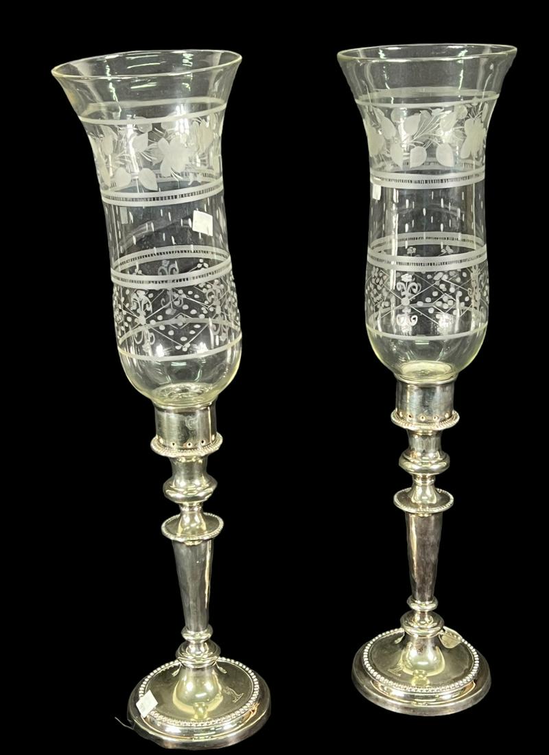 PAIR OF ANTIQUE SILVER & GLASS CANDLE HOLDERS: PAIR OF ANTIQUE SILVER & GLASS HURRICANE CANDLE HOLDERS. Height: 21.5 in. by Width: 5.5 in. by Depth: 5.5 in.