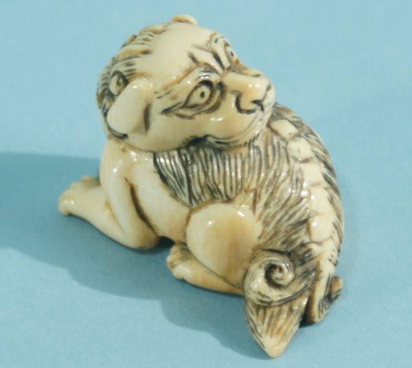 LOT OF TWO IVORY NETSUKE: LOT OF TWO IVORY NETSUKE. IVORY NETSUKE OF A FOO DOG. HARE ON TORTOISE BACK. Height: 1 1/4 and 2 in. by Width: 1 1/2 and 1 in. by Depth: 1 and 1 1/4 in.