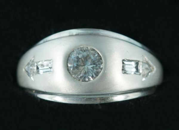 NEW MEN'S STAMPED 14KT WHITE GOLD RING: NEW MEN'S STAMPED 14KT WHITE GOLD RING. THERE IS A GIPSY-SET ROUND SPINEL WT. APPROX. 0.65CTS. THERE ARE AN ADDITIONAL 4 SPINELS WEIGHING APPROX. 1.0 CARAT. TOTAL APPROX. RING WEIGHT IS 7.0 GRAMS.