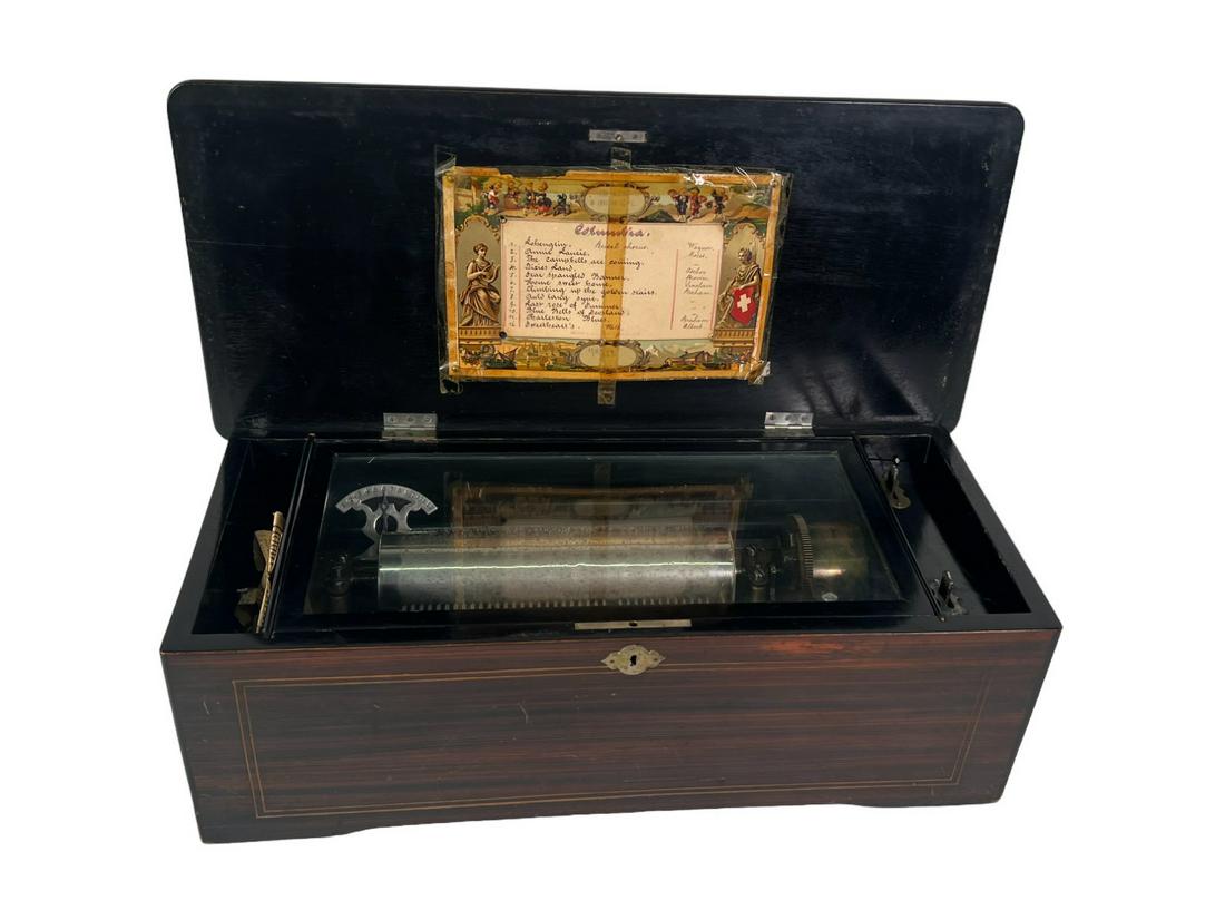 ANTIQUE ROSEWOOD MUSIC BOX: ANTIQUE ROSEWOOD MUSIC BOX. Height: 7.25 in. by Width: 21 in. by Depth: 10 in.