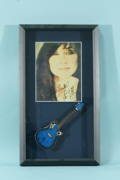 PAT TILLIS SIGNED PHOTO AND MINI GUITAR: PAT TILLIS SIGNED PHOTO AND MINI GUITAR
